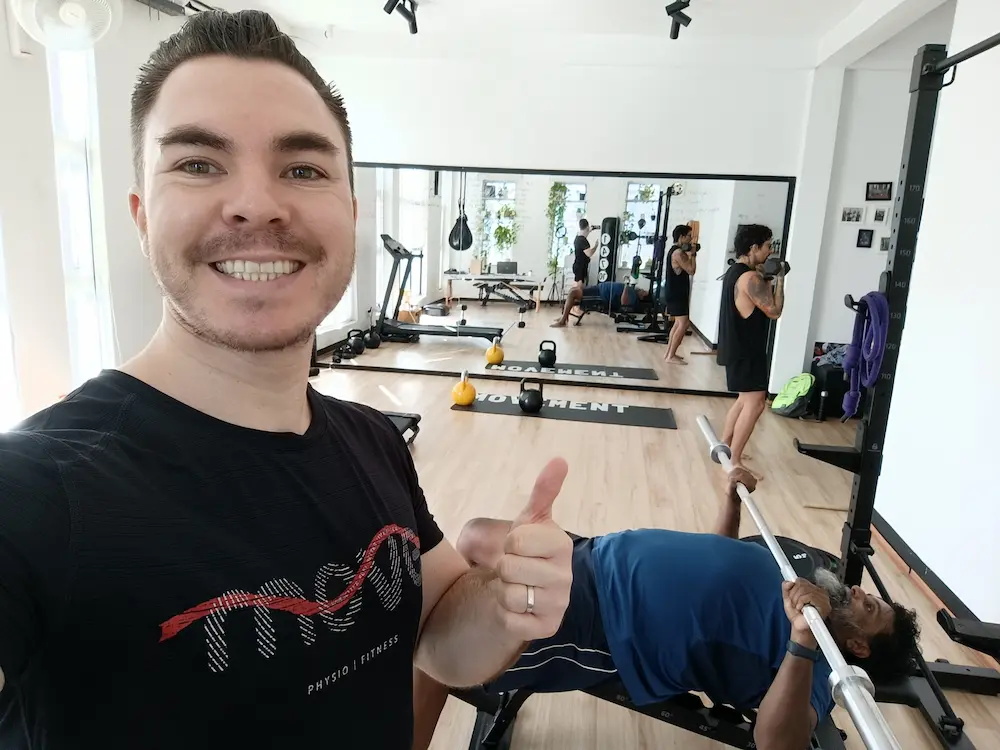 Strength-focused small group fitness class in Phnom Penh using barbells and kettlebells